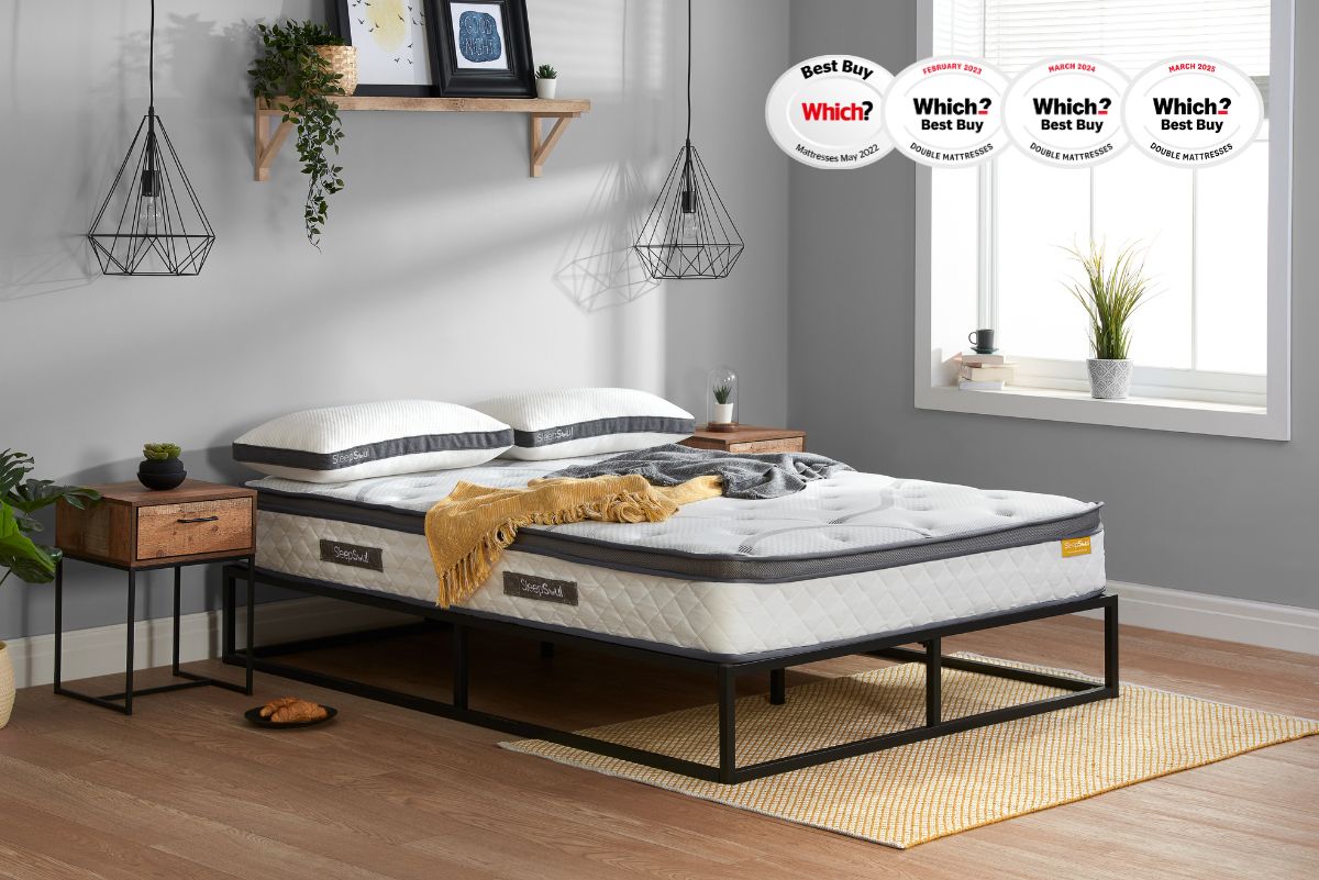 SleepSoul Heaven 1000 pocket spring coolgel mattress on black metal bed, in minimalist bedroom with wood and metal side tables, hanging lamps, shelf, plants and window light